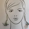 Aretes en forma de grullas voladoras.